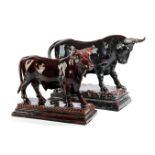 TWO PORTUGUESE POTTERY MODELS OF BULLS BY CALDAS, LATE 19TH / EARLY 20TH CENTURY each with a dark