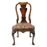A GEORGE I WALNUT SIDE CHAIR C.1720 the scroll top rail above a vase shape splat and a needlework