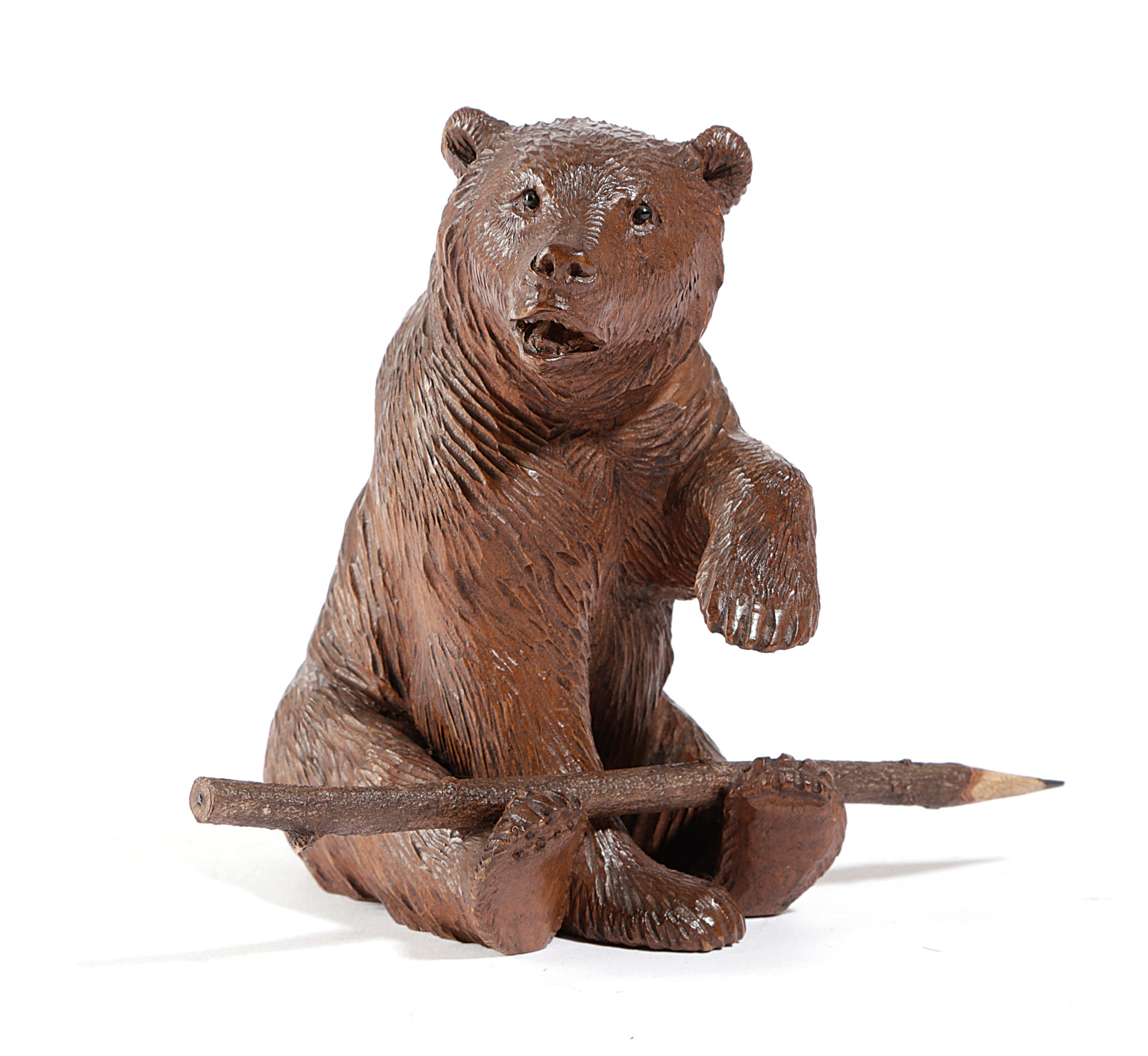 A BLACK FOREST LINDEN WOOD BEAR PEN HOLDER LATE 19TH / EARLY 20TH CENTURY the seated bear with glass