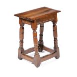 AN OAK JOINT STOOL MID-17TH CENTURY the rectangular top with a triple moulded edge, above sausage