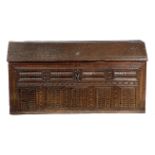 A LARGE OAK COFFER POSSIBLY FLEMISH OR SCANDINAVIAN, 16TH / 17TH CENTURY of ark form, the hinged top