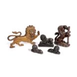 FIVE CAST IRON MODELS OF LIONS 19TH CENTURY comprising: a heraldic example of a rampant lion,