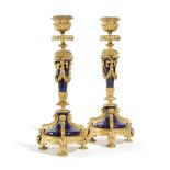 A PAIR OF FRENCH NAPOLEON III ORMOLU AND PORCLELAIN CANDLESTICKS IN LOUIS XVI SEVRES STYLE each with
