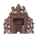 A LATE VICTORIAN SCOTTISH PAINTED CAST IRON MINIATURE FIREPLACE BY GREENLEES OF GLASGOW, LATE 19TH