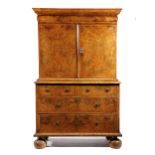 A WILLIAM AND MARY WALNUT CABINET ON CHEST C.1690-1700 cross and feather banded with burr veneers,