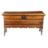 A LARGE CHARLES I ELM COFFER C.1640 of five plank construction, the hinged lid with a moulded