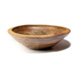 A LARGE TREEN ELM TURNED DAIRY BOWL 19TH CENTURY with a moulded rim 60.7cm diameter