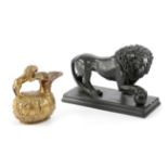 AN EBONISED PLASTER MODEL OF THE MEDICI LION 20TH CENTURY together with an Italian gilt plaster