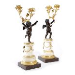 A PAIR OF GILT AND PATINATED BRONZE FIGURAL CANDELABRA LATE 18TH / EARLY 19TH CENTURY each with a