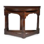 A CHARLES I OAK FOLDING / CREDENCE TABLE C.1640 the demi-lune hinged top on a single gate support,