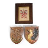 λ HERALDRY INTEREST. A PAIR OF PAINTED CARVED OAK SHIELDS 19TH CENTURY AND LATER one with a spread