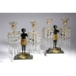 A PAIR OF REGENCY GILT AND PATINATED BRONZE FIGURAL CANDELABRA EARLY 19TH CENTURY each with a
