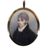 λEnglish School c.1800 Portrait miniature of a gentleman wearing a blue double-breasted coat Oval,