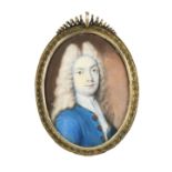 λEnglish School c.1700 Portrait miniature of a gentleman wearing a blue coat and long powdered wig