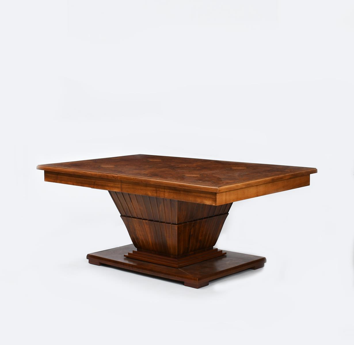 An Art Deco burr walnut extending pedestal dining table, the rectangular top with quarter-sawn