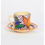 'Garland' a Clarice Cliff Fantasque Bizarre Tankard coffee can and saucer, painted in colours