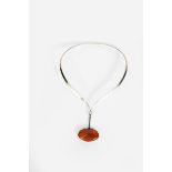 A Georg Jensen silver neckring and pendant designed by Vivianna Torun Bulow-Hube, model no.133,