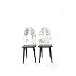 A pair of Fornasetti Studios Quattro Stagioni chairs designed by Piero Fornasetti, each printed with