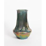 A Carter's Poole Pottery vase probably designed by Owen Carter, gadrooned, shouldered formed covered