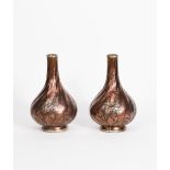 A pair of Boch Freres Keramis bottle vases, shape no.252, moulded, twisted body painted with