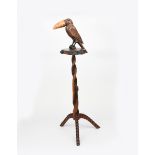 A carved wood novelty gong stand, in the manner of Henry Howell Ltd, the carved bird with applied