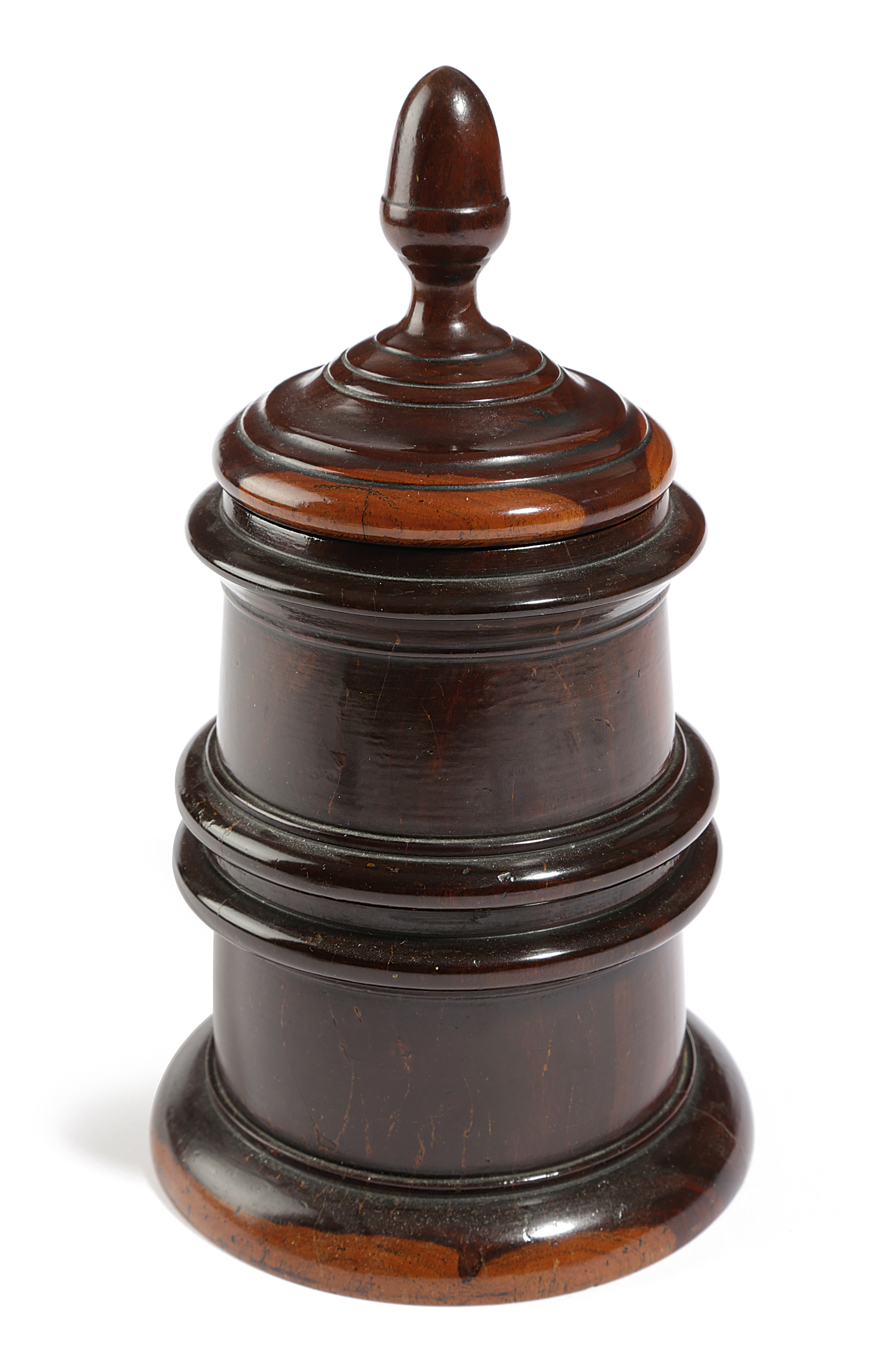 A TREEN LIGNUM VITAE TOBACCO JAR EARLY 19TH CENTURY the lid with an acorn finial, the body with