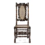 A CHARLES II WALNUT SIDE CHAIR LATE 17TH CENTURY with a caned back and seat, with boy's head finials