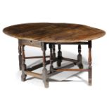 A WILLIAM AND MARY YEW GATELEG DINING TABLE LATE 17TH / EARLY 18TH CENTURY the oval drop-leaf top on