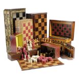 A COLLECTION OF CHESS SETS AND GAME BOARDS 19TH CENTURY AND LATER comprising: a boxwood and ebony