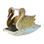 A FOLK ART PAINTED WOOD CHILD'S ROCKING CHAIR FIRST HALF 20TH CENTURY in the form of a swan, with