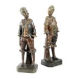 A PAIR OF VICTORIAN PAINTED TERRACOTTA FIGURES OF CLOWNS BY PHILLIPS, PROBABLY WESTON SUPER MARE,