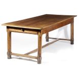 A FRENCH CHERRYWOOD FARMHOUSE KITCHEN TABLE 19TH CENTURY the boarded top with cleated ends, above