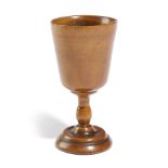 A GEORGE III TREEN APPLE GOBLET C.1780-1800 with a turned stem and a slightly domed foot 10.5cm high