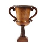 A TREEN YEW URN LATE 18TH / EARLY 19TH CENTURY with a detachable fluted rim and applied scroll