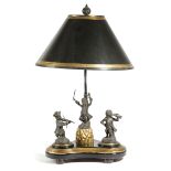 A FRENCH BRONZE AND GILTWOOD 'MONKEY BAND' TABLE LAMP decorated with three figures, including a