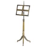 A REGENCY EBONISED AND PENWORK MUSIC STAND EARLY 19TH CENTURY gilt decorated with bands of oak