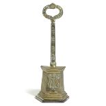 A WILLIAM IV BRASS DOORSTOP C.1835 decorated with a lyre, the stem and handle with anthemion motifs,