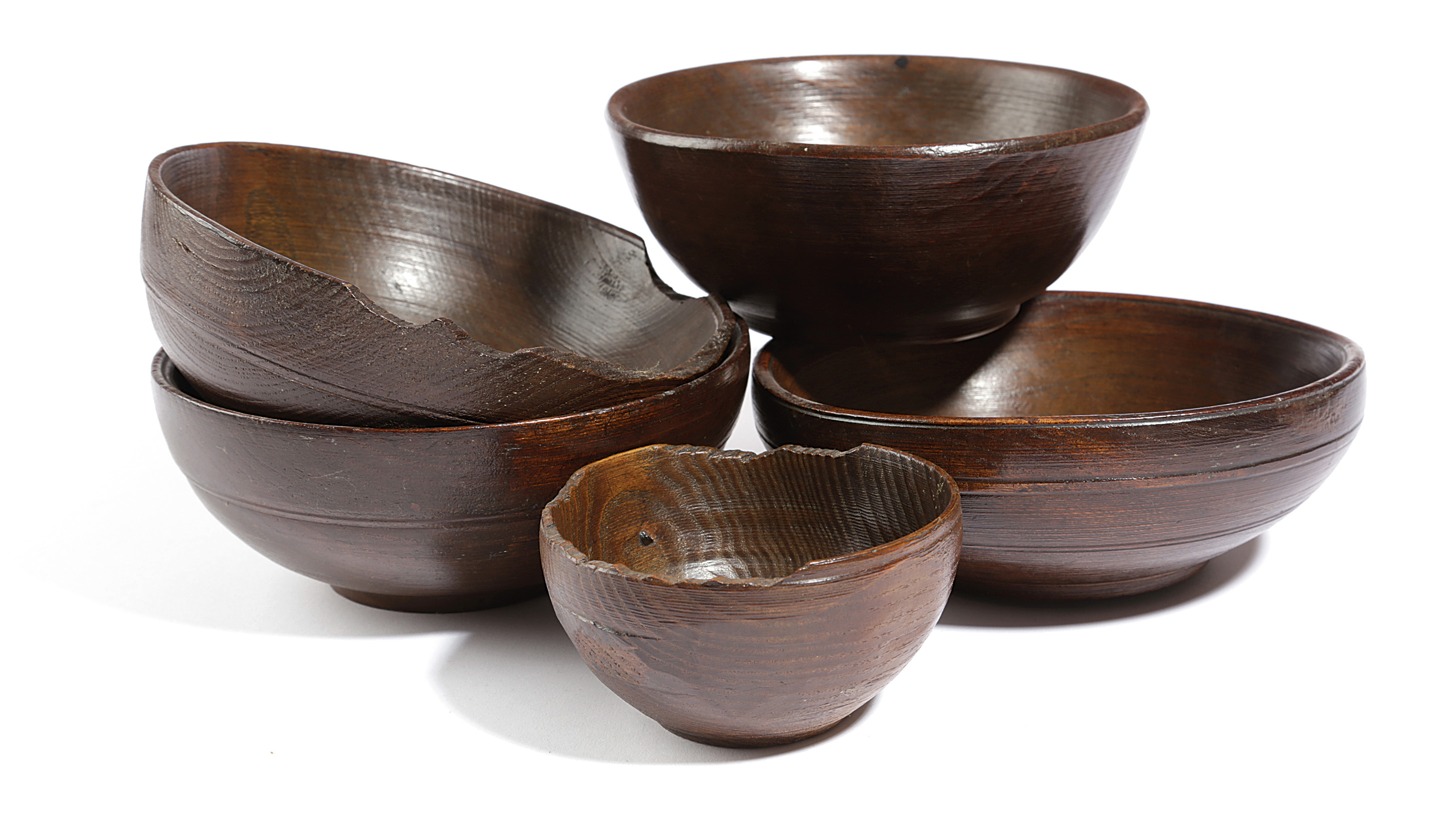 FIVE TREEN BOWLS 19TH CENTURY in elm and beech, one branded with owner's initials 'J C' (5) 18.7cm