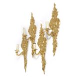A SET OF FOUR ORMOLU WALL LIGHTS IN ROCOCO STYLE 20TH CENTURY each with a single light, the