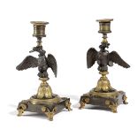 A PAIR OF REGENCY GILT AND PATINATED BRONZE EAGLE CANDLESTICKS EARLY 19TH CENTURY each with an urn