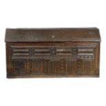 A LARGE OAK COFFER POSSIBLY FLEMISH OR SCANDINAVIAN, 16TH / 17TH CENTURY of ark form, the hinged top