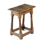 A CHARLES II OAK JOINT STOOL C.1660 on ring turned legs united by peripheral stretchers 52.5cm high,