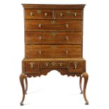 AN OAK CHEST ON STAND EARLY 18TH CENTURY inlaid with fruitwood and parquetry banding, with two short