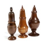 THREE TREEN CASTERS OR MUFFINEERS LATE 18TH / 19TH CENTURY one possibly yew, of baluster form and