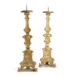 A PAIR OF GILTWOOD ALTAR CANDLESTICKS IN BAROQUE STYLE SPANISH OR ITALIAN, 18TH CENTURY each with an