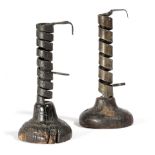 TWO FRENCH IRON AND TREEN PIGTAIL CANDLESTICKS LATE 18TH / EARLY 19TH CENTURY of spiral twist open