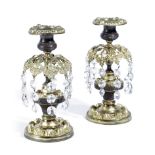 A PAIR OF REGENCY GILT AND PATINATED BRASS CANDLESTICKS EARLY 19TH CENTURY each hung with cut-