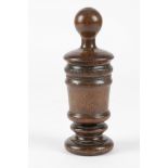 A TREEN FRUITWOOD MORTAR GRATER 18TH CENTURY in two parts, with a turned pestle handle, revealing