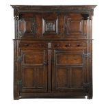 A WILLIAM AND MARY WELSH OAK COURT CUPBOARD DATED '1695' in two parts, the top with two fielded