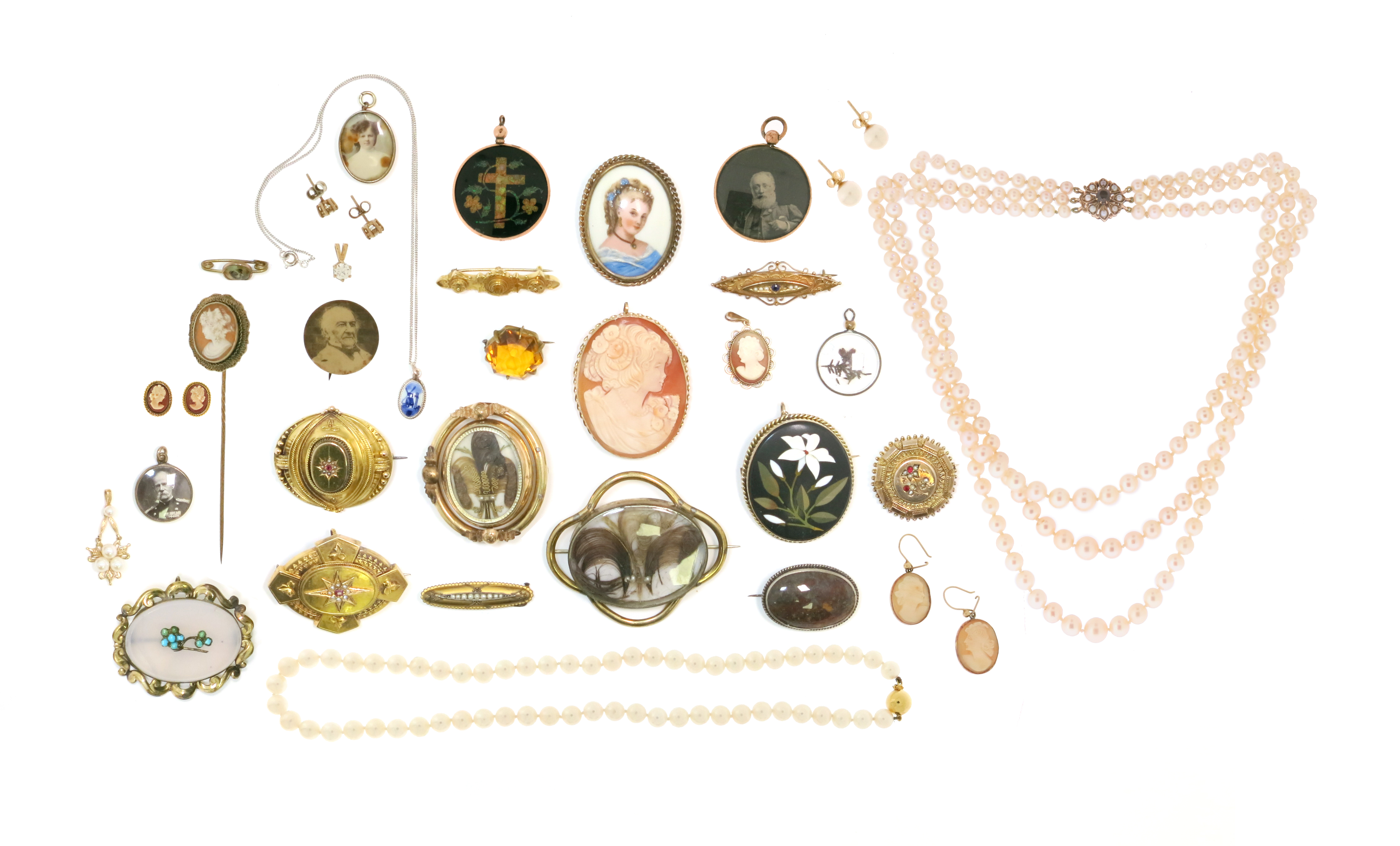 A collection of jewellery, including; fifteen assorted brooches; nine pendants; a stick pin; two